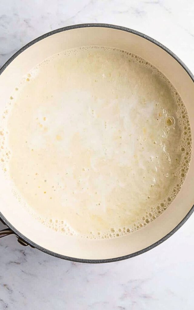Milk steaming in a saucepan