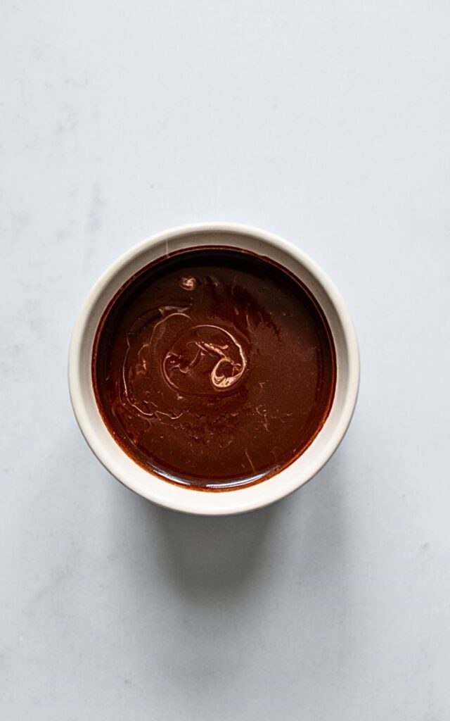Whisking sugar, vanilla, & pinch of salt